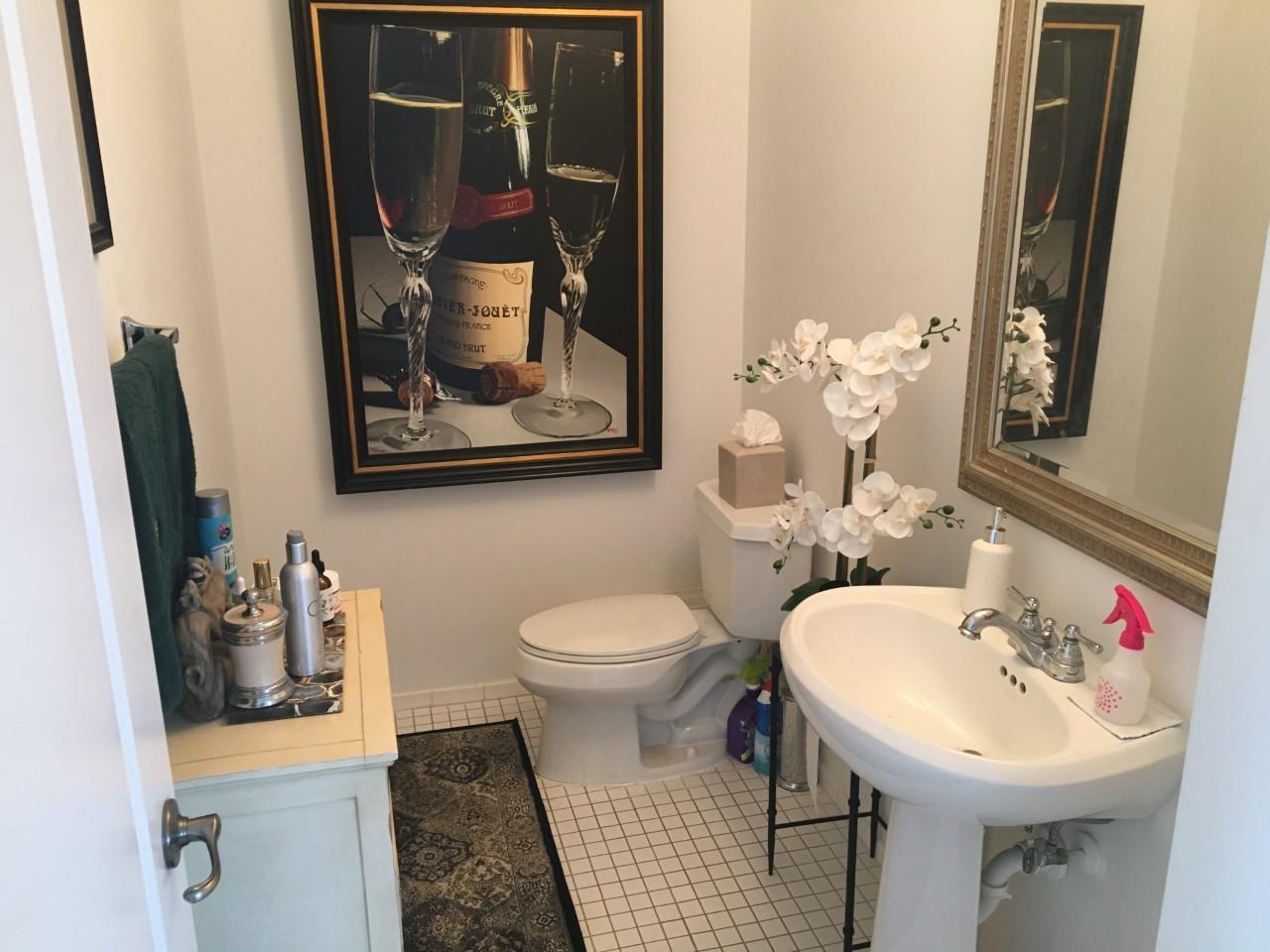 555 Northwest 35th Place Boca Raton, FL 33431 - Photo 18 of 43 a bathroom with a sink toilet and mirror