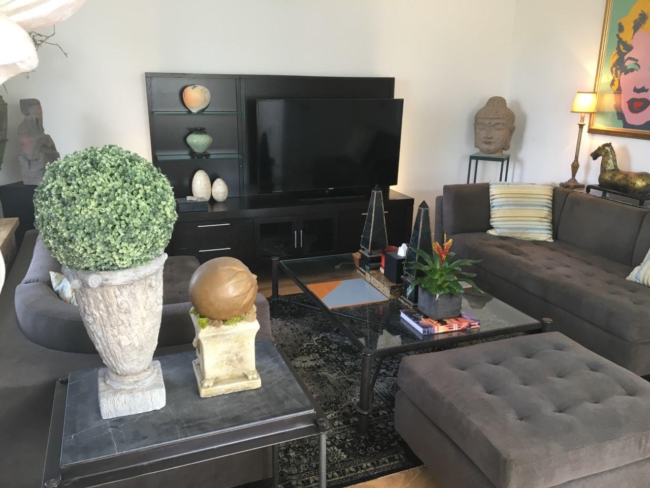555 Northwest 35th Place Boca Raton, FL 33431 - Photo 21 of 43 a living room with furniture and a flat screen tv