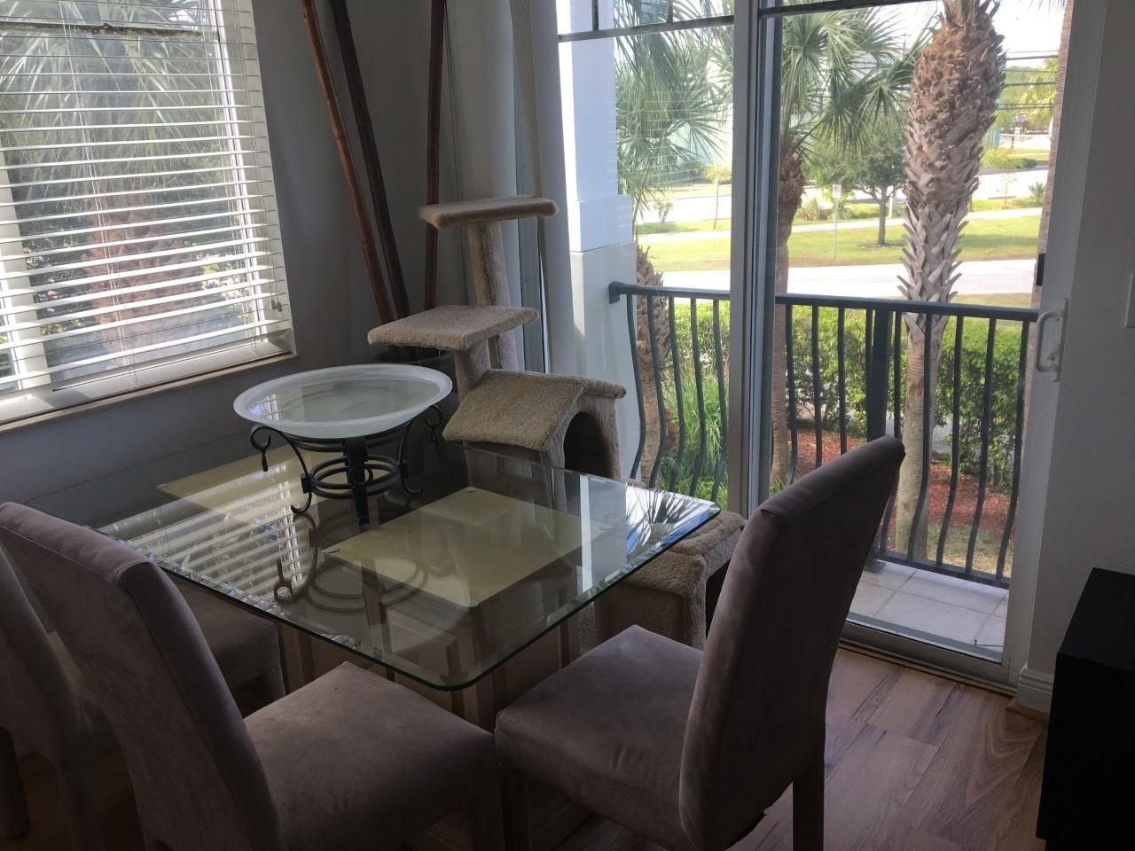 555 Northwest 35th Place Boca Raton, FL 33431 - Photo 22 of 43 a view of a dining room with furniture wooden floor and a potted plant
