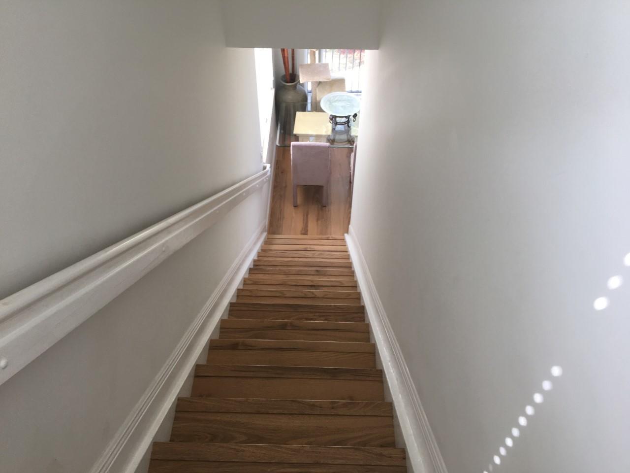 555 Northwest 35th Place Boca Raton, FL 33431 - Photo 24 of 43 a view of a hallway with wooden floor and a chandelier