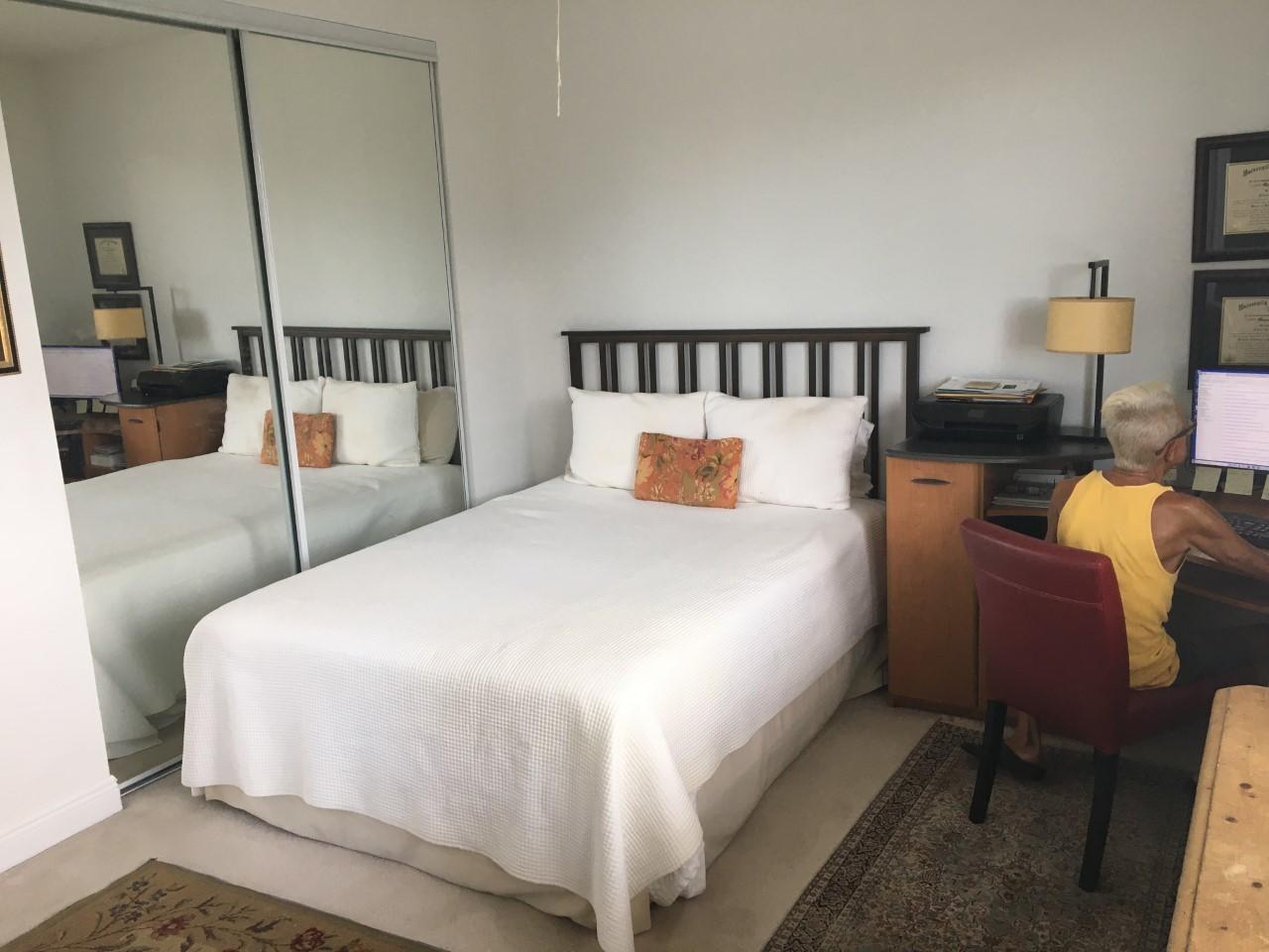 555 Northwest 35th Place Boca Raton, FL 33431 - Photo 27 of 43 a large bed sitting in a bedroom next to a window