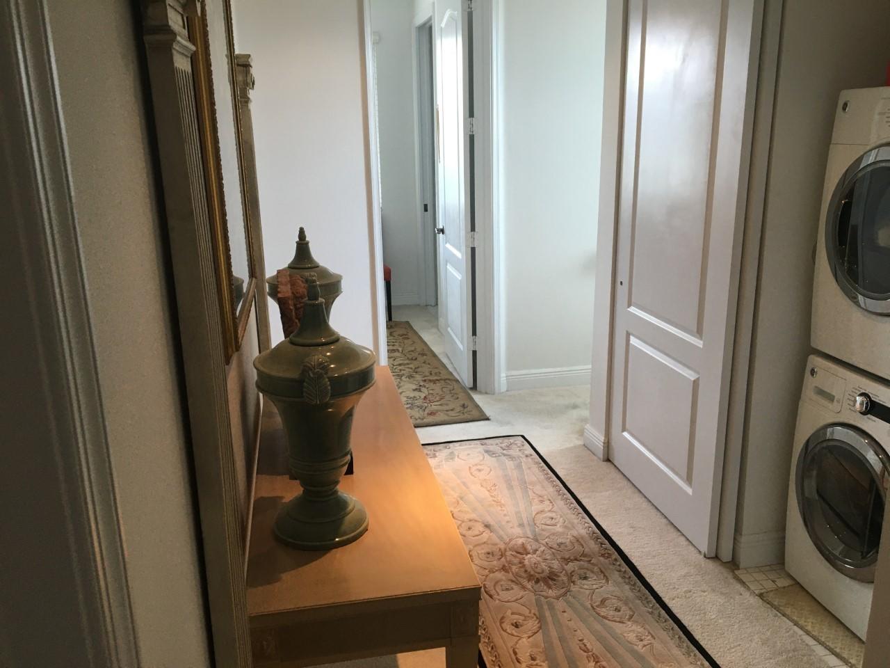 555 Northwest 35th Place Boca Raton, FL 33431 - Photo 29 of 43 a view of a hallway with washer and dryer