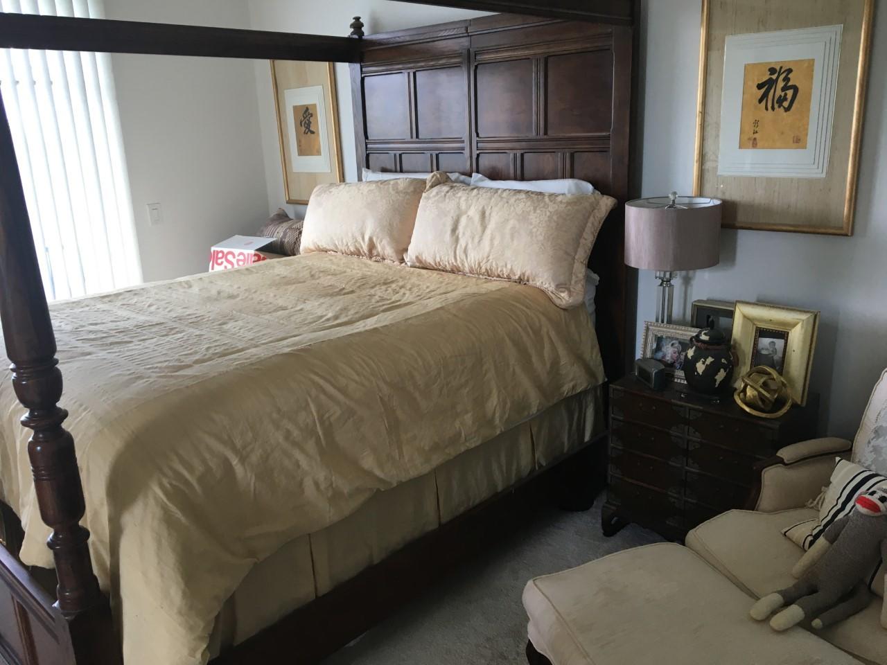 555 Northwest 35th Place Boca Raton, FL 33431 - Photo 30 of 43 a bed sitting in a bedroom next to a window
