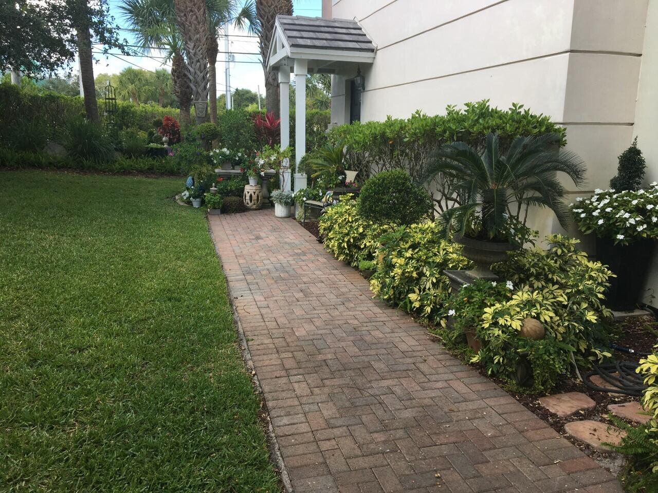 555 Northwest 35th Place Boca Raton, FL 33431 - Photo 3 of 43 a view of a garden with flower plants
