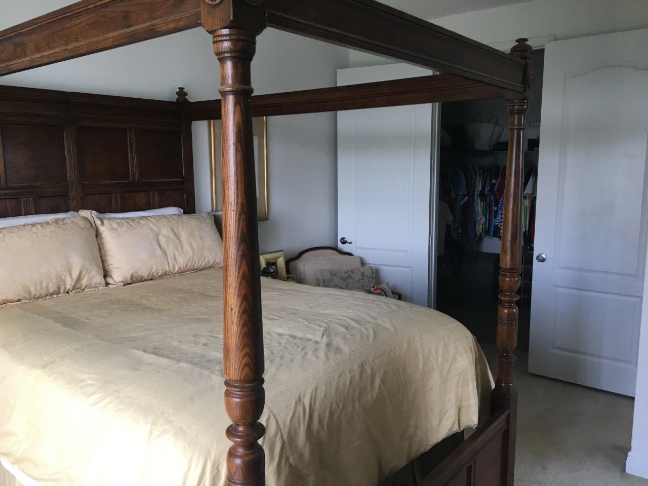 555 Northwest 35th Place Boca Raton, FL 33431 - Photo 31 of 43 a bedroom with a bed and a mirror