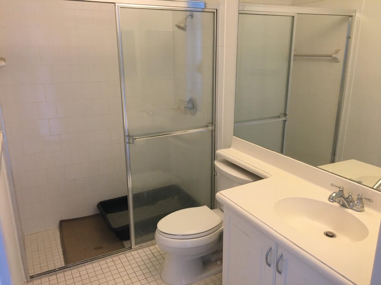555 Northwest 35th Place Boca Raton, FL 33431 - Photo 10 of 43 a bathroom with a sink a toilet and shower