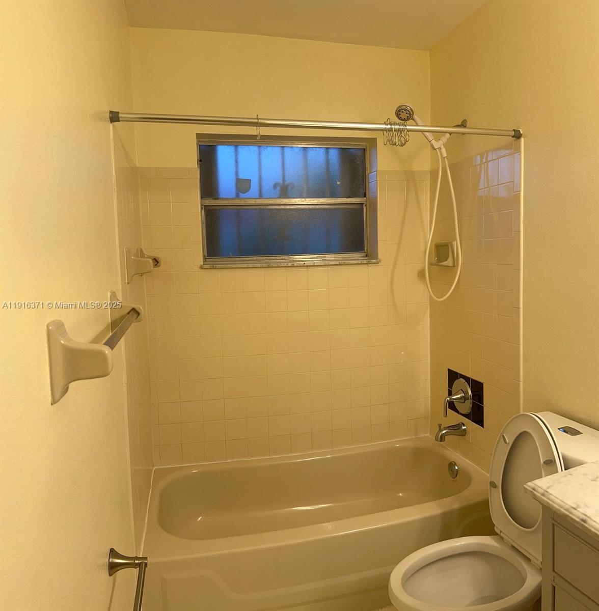 26636 Southwest 126th Avenue Homestead, FL 33032 - Photo 11 of 14 a bathroom with a shower and a sink