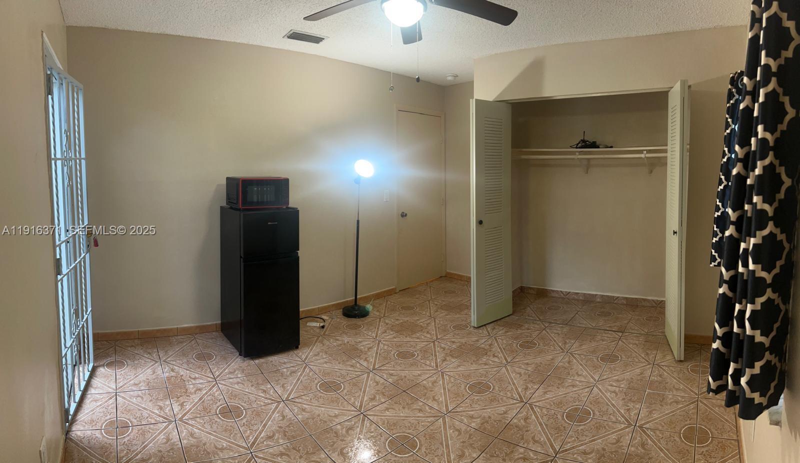 26636 Southwest 126th Avenue Homestead, FL 33032 - Photo 3 of 14 a view of an empty room