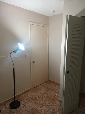 a view of a utility room with closet