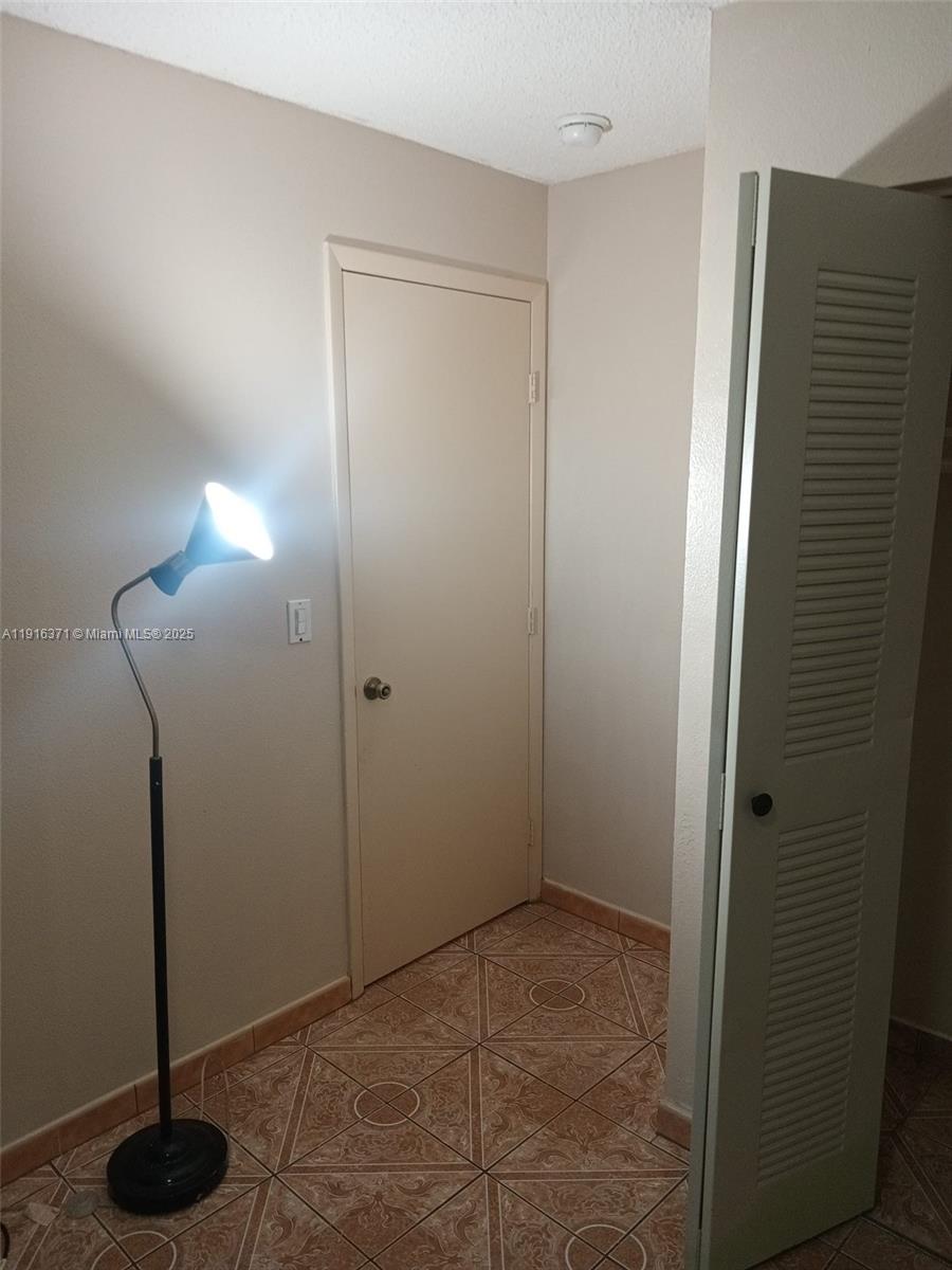 26636 Southwest 126th Avenue Homestead, FL 33032 - Photo 6 of 14 a view of an empty room