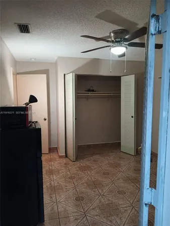 a view of a utility room with closet