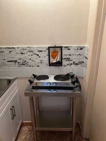 a sink sitting inside of a kitchen