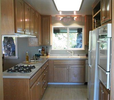 2575 Laguna Road Santa Rosa, CA 95401 - Photo 5 of 6 a kitchen with a stove a refrigerator and a sink