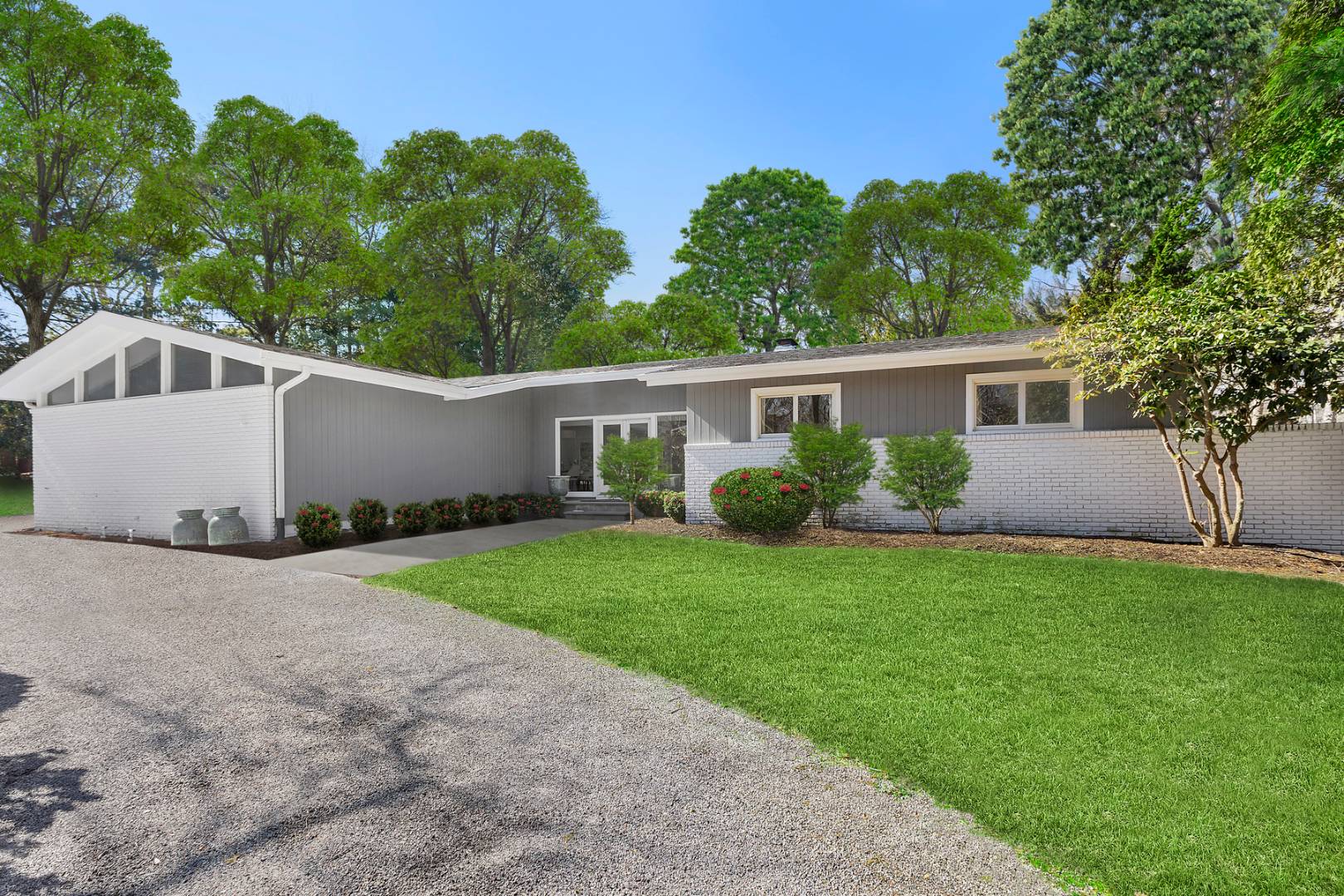 218 Bull Path East Hampton, NY 11937 - Photo 2 of 20 front view of a house with a yard