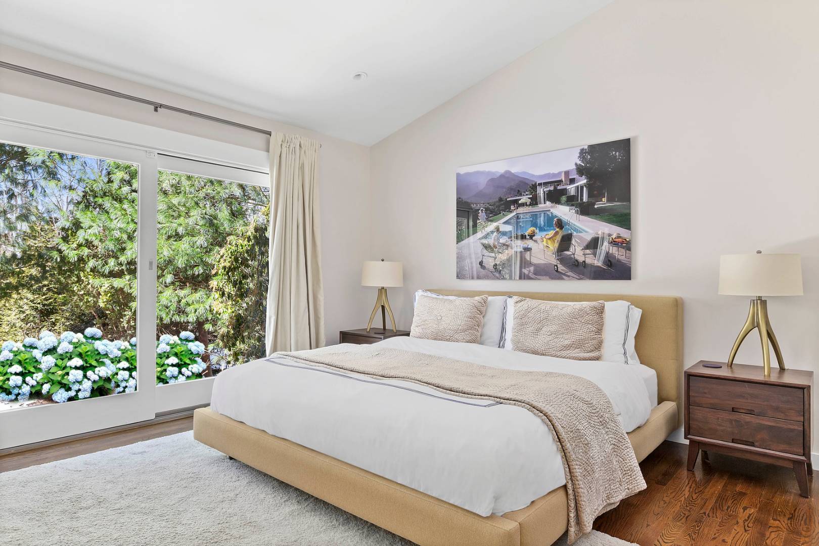 218 Bull Path East Hampton, NY 11937 - Photo 12 of 20 a bedroom with a bed and a painting on the wall