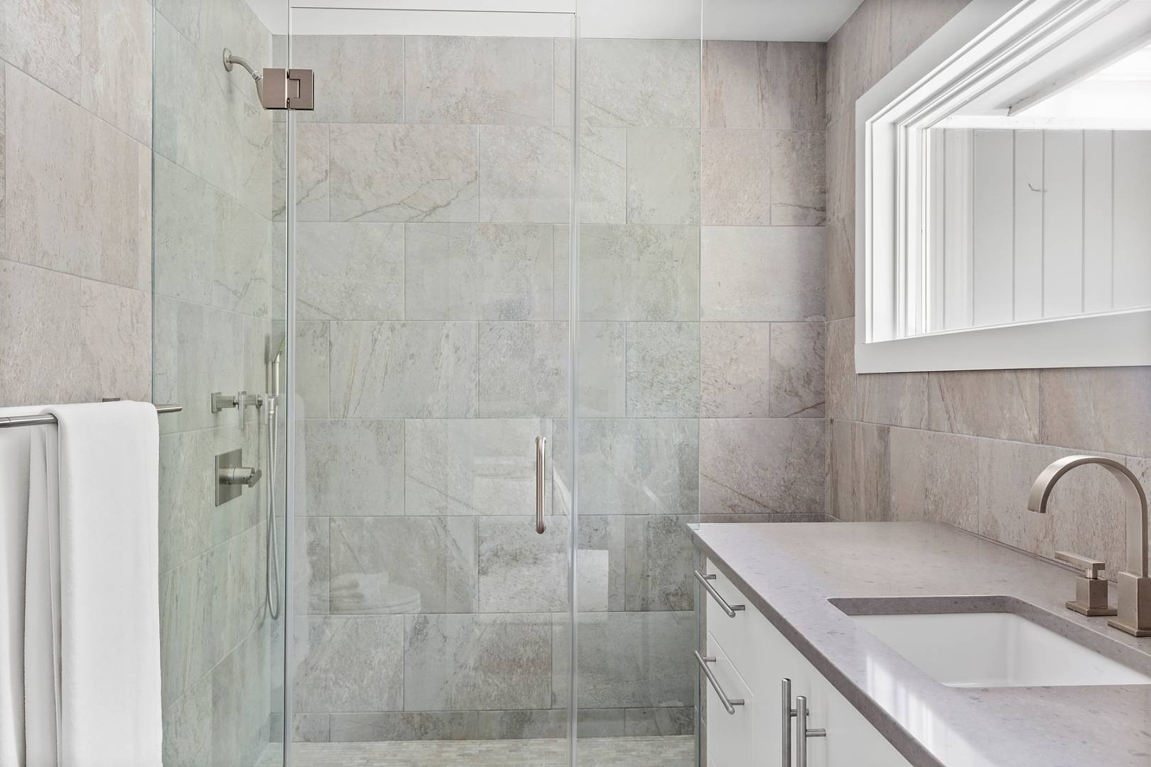 218 Bull Path East Hampton, NY 11937 - Photo 14 of 20 a bathroom with a sink shower and a mirror