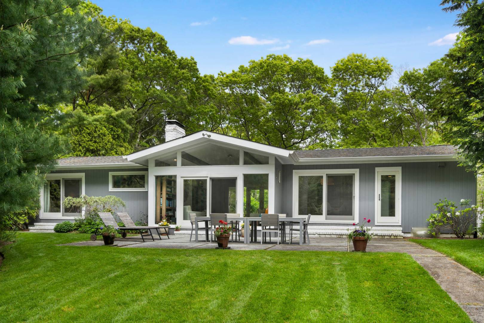 218 Bull Path East Hampton, NY 11937 - Photo 19 of 20 a front view of house with yard and outdoor seating