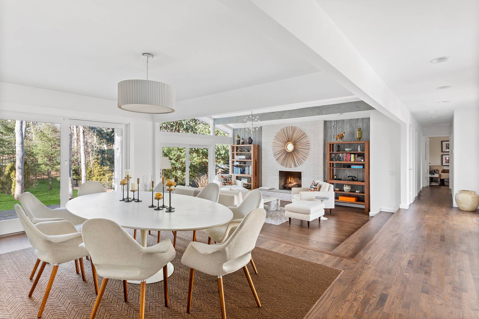 218 Bull Path East Hampton, NY 11937 - Photo 4 of 20 a view of a dining room with furniture wooden floor and chandelier