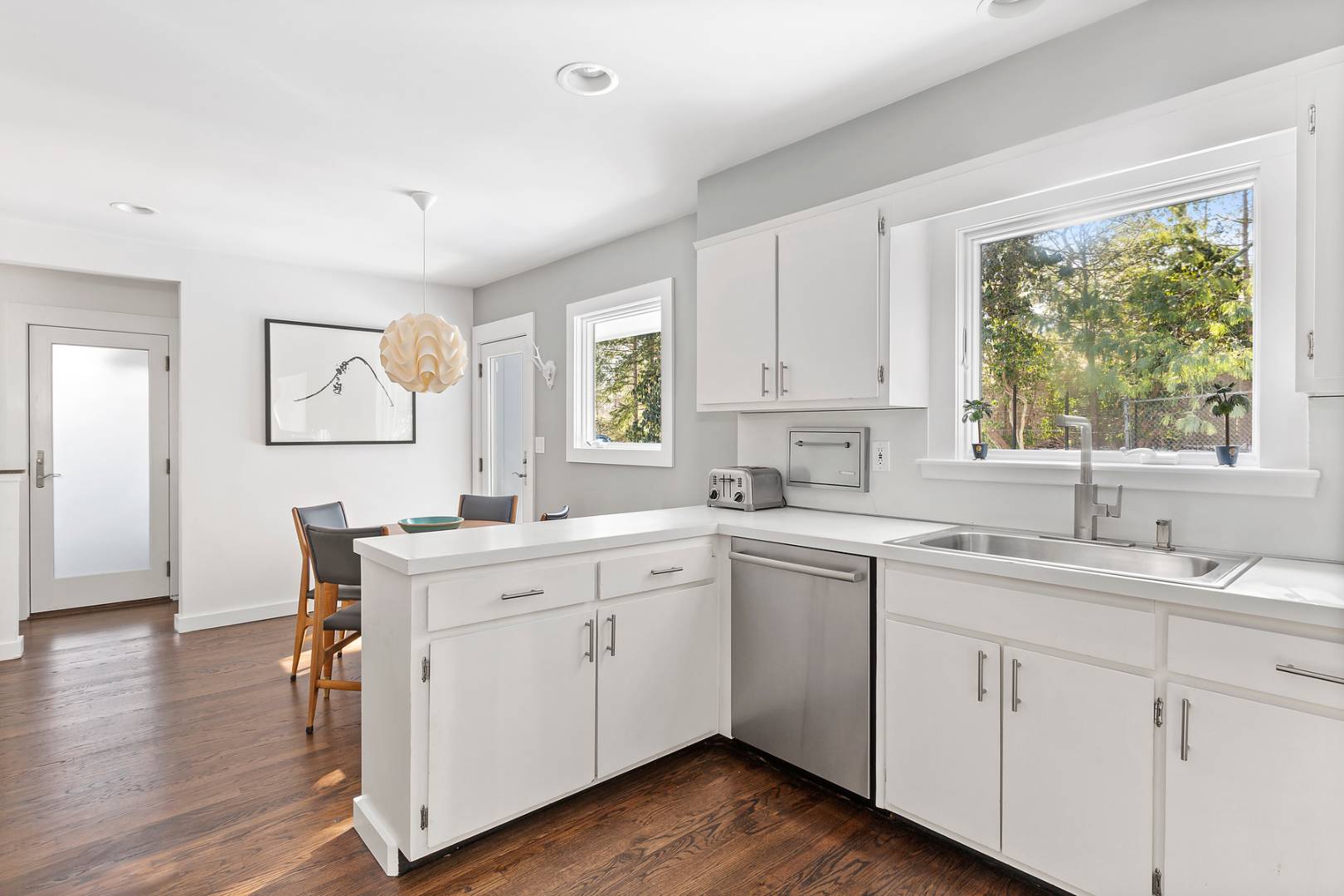 218 Bull Path East Hampton, NY 11937 - Photo 10 of 20 a kitchen with a sink cabinets and wooden floor