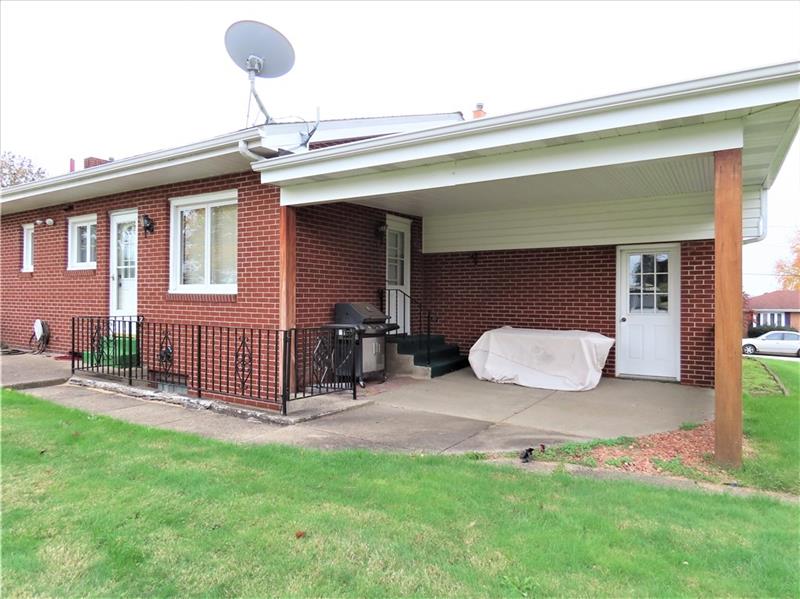 675 Davidson Drive Rochester, PA 15074 - Photo 24 of 25 Rear large covered patio with access to dining room. *rear door to garage too.