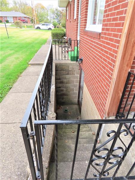 675 Davidson Drive Rochester, PA 15074 - Photo 25 of 25 Exterior access to lower level of home. Railings with a gate