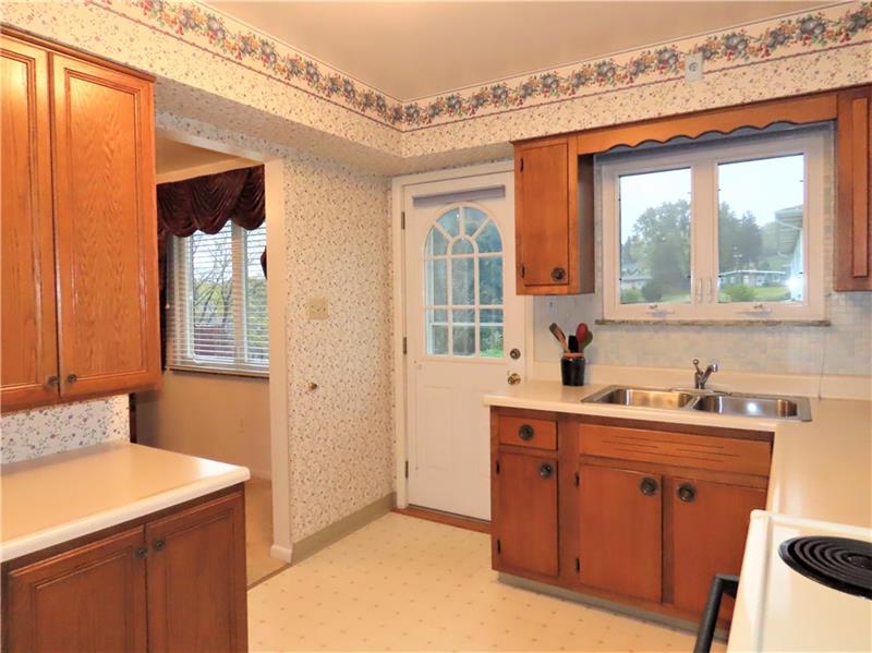 675 Davidson Drive Rochester, PA 15074 - Photo 9 of 25 Kitchen offers rear entry to small patio and view of back yard!