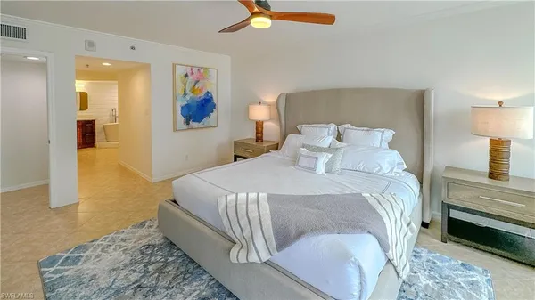 a bathroom with a tub a sink and mirror