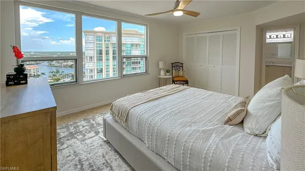 a bedroom with a large bed and a window