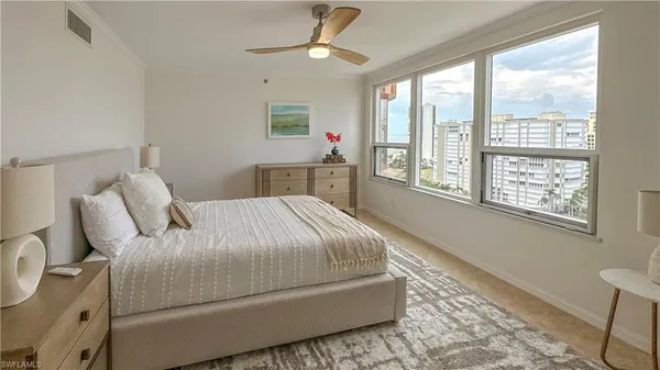 a bedroom with a bed and a table