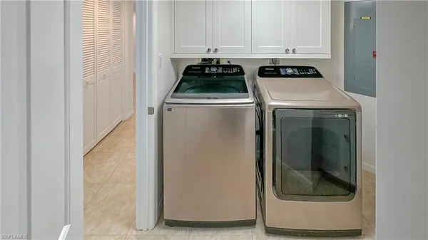 a living room with lots of furniture and a large window