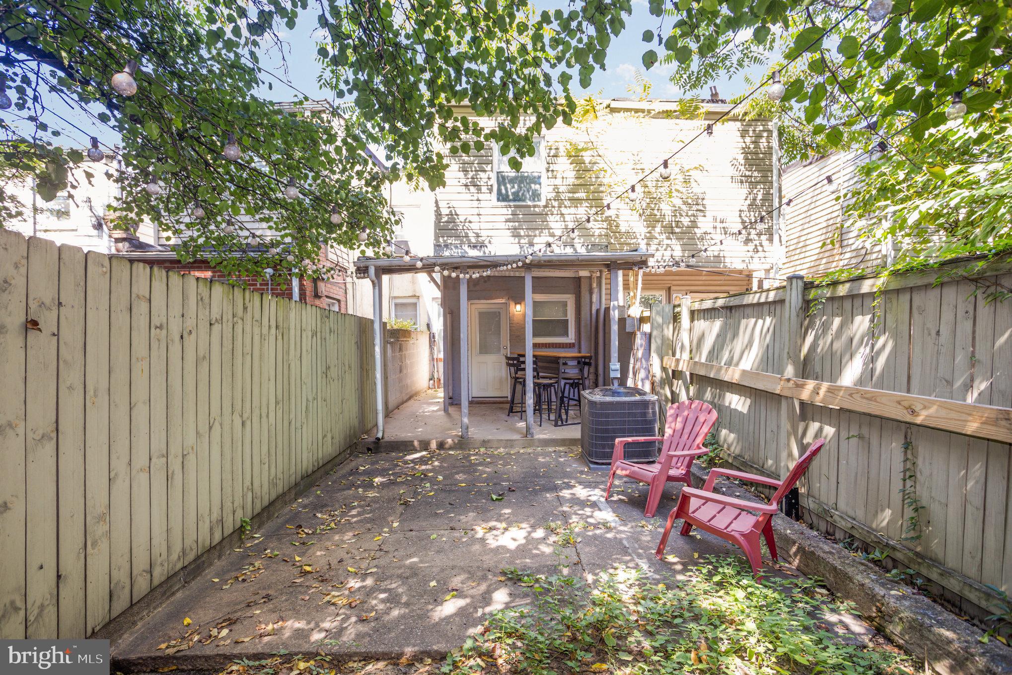 3515 Gough Street Baltimore, MD 21224 - Photo 27 of 27 a view of backyard with outdoor seating and trees