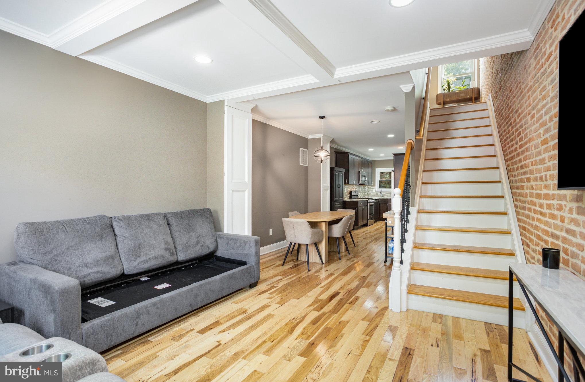 3515 Gough Street Baltimore, MD 21224 - Photo 4 of 27 a living room with furniture and a wooden floor