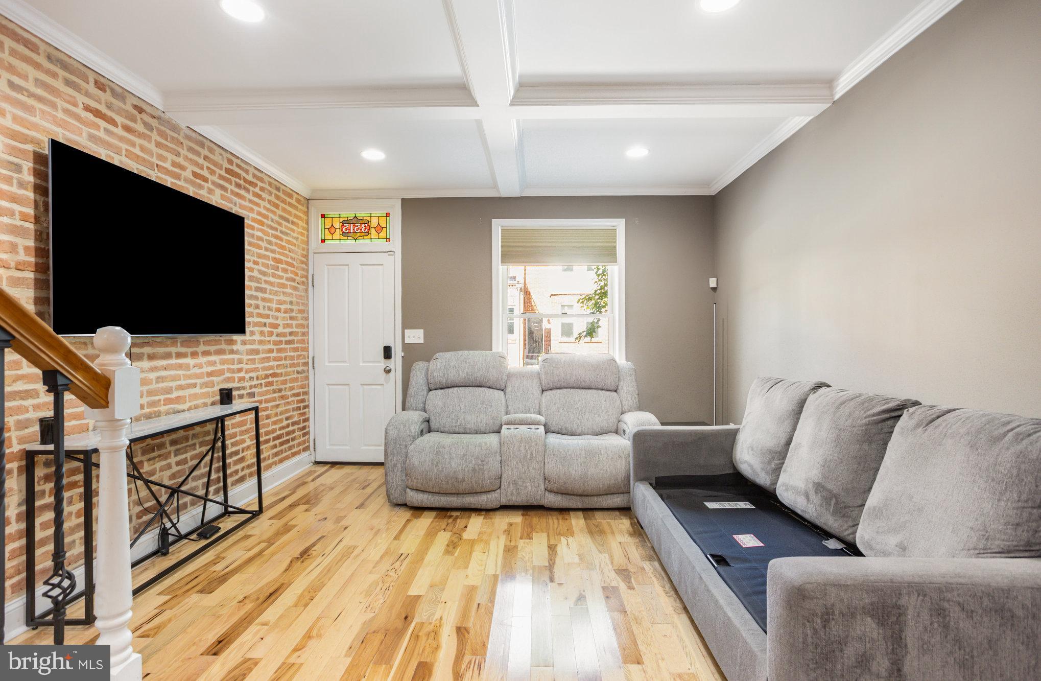3515 Gough Street Baltimore, MD 21224 - Photo 5 of 27 a living room with furniture and a flat screen tv