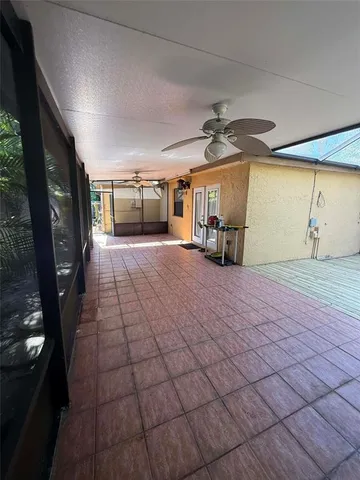 a view of an empty room and a window