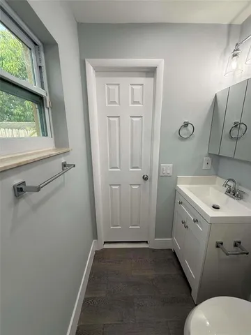 a bathroom with a toilet sink and shower