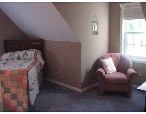 292 Cedar Street Sturbridge, MA 01518 - Photo 12 of 20 a bed room with a bed and a couch