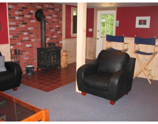 292 Cedar Street Sturbridge, MA 01518 - Photo 15 of 20 a living room with furniture and a fireplace