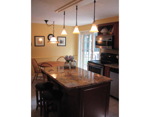 292 Cedar Street Sturbridge, MA 01518 - Photo 3 of 20 a kitchen with a table and chairs