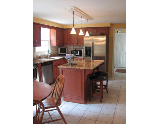 292 Cedar Street Sturbridge, MA 01518 - Photo 4 of 20 a view of a dining room with furniture and a chandelier