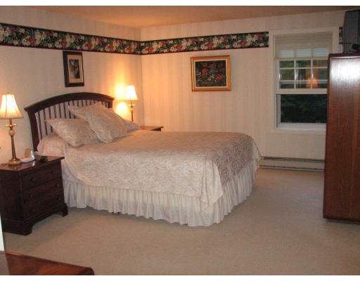 292 Cedar Street Sturbridge, MA 01518 - Photo 8 of 20 a bedroom with a bed and a window