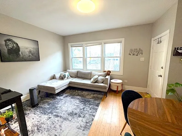 a living room with furniture and a rug