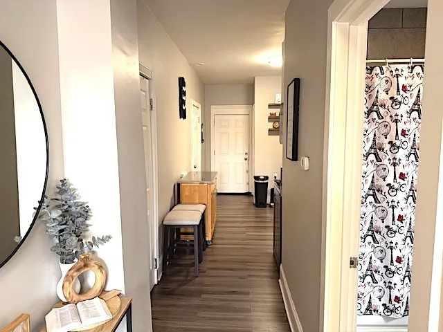 a view of a livingroom with furniture and wooden floor