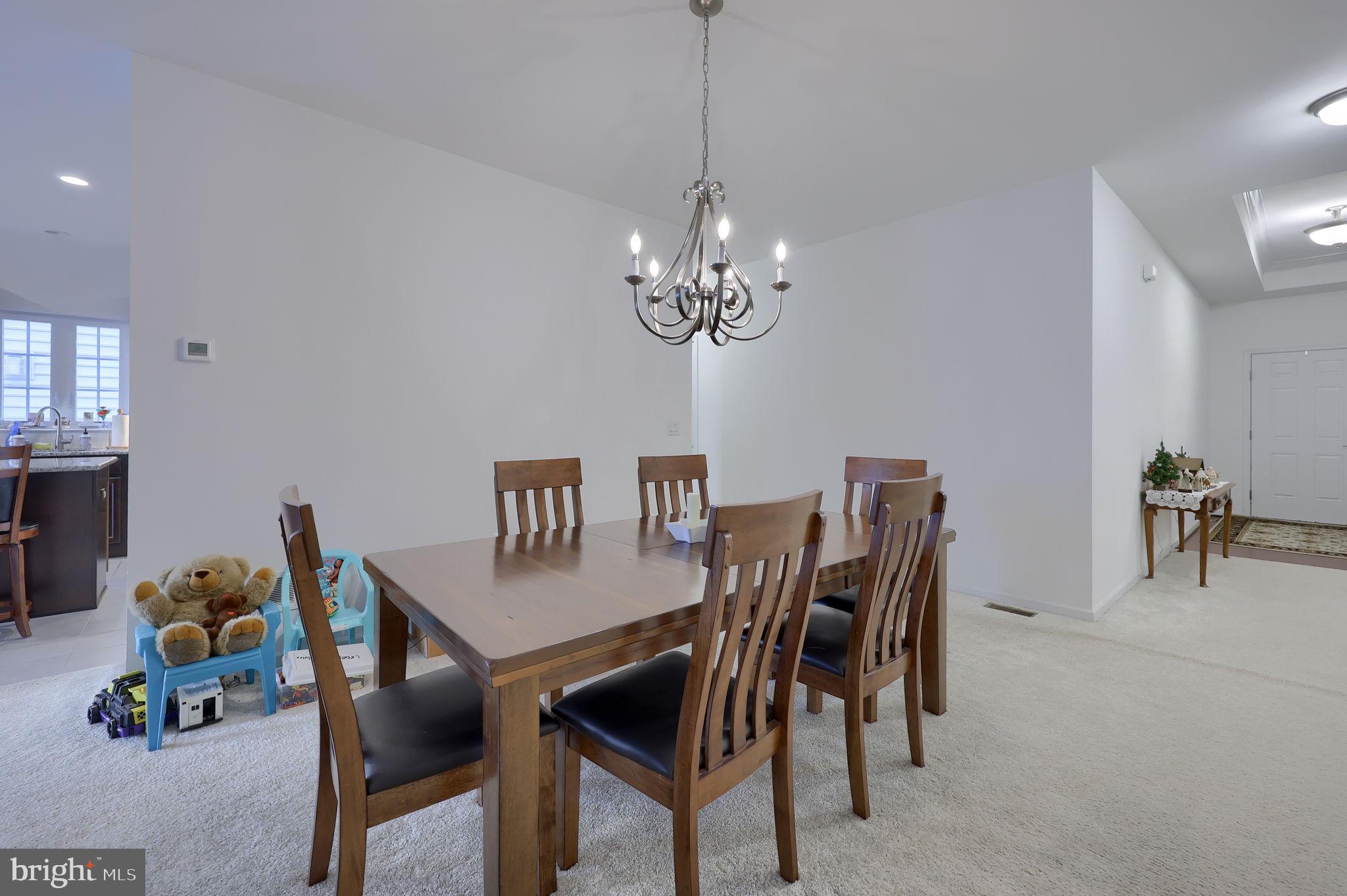 423 Valor Drive Lititz, PA 17543 - Photo 14 of 29 a dining room with furniture and chandelier