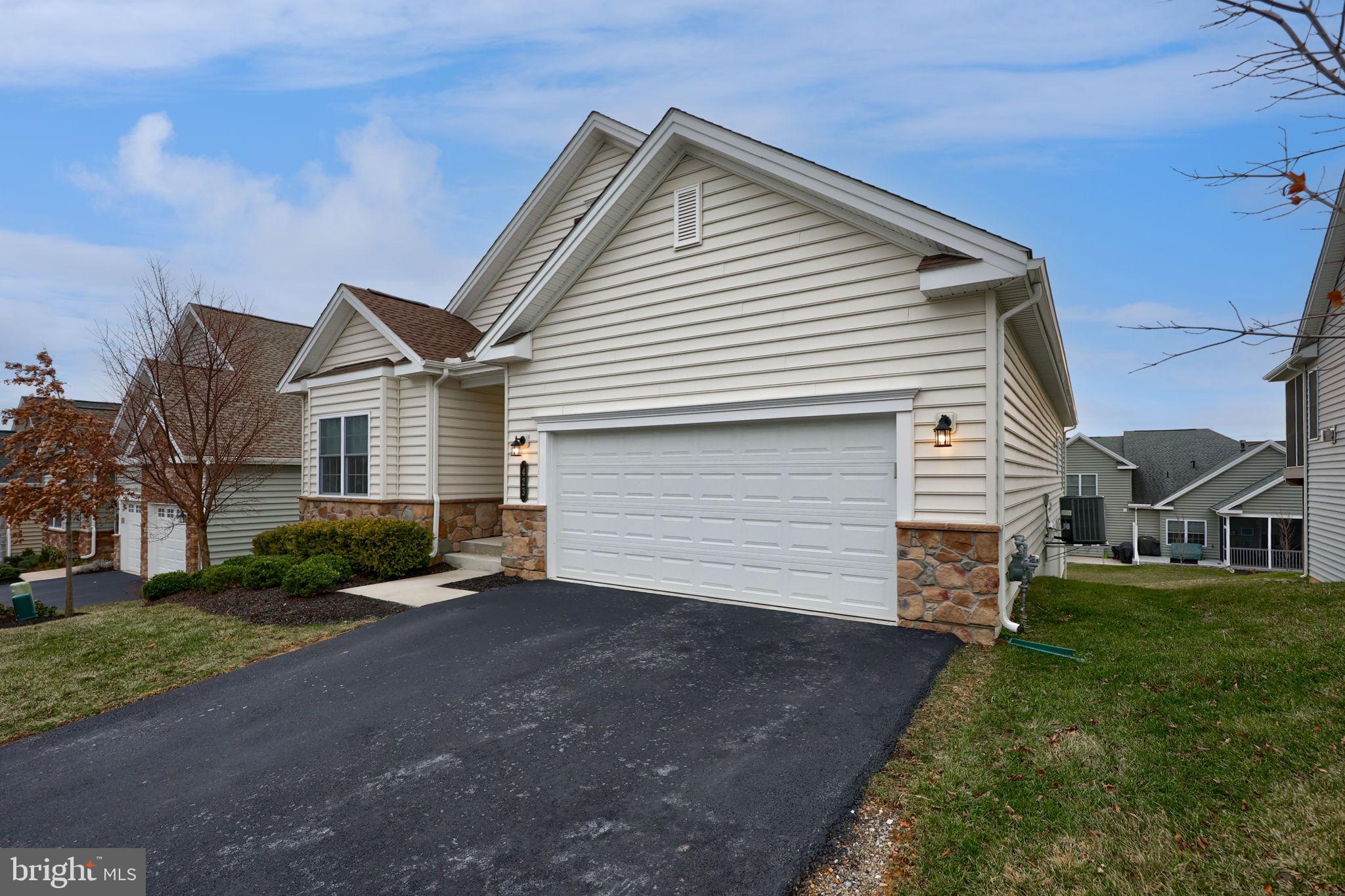 423 Valor Drive Lititz, PA 17543 - Photo 28 of 29 a view of a white house next to a yard and large trees