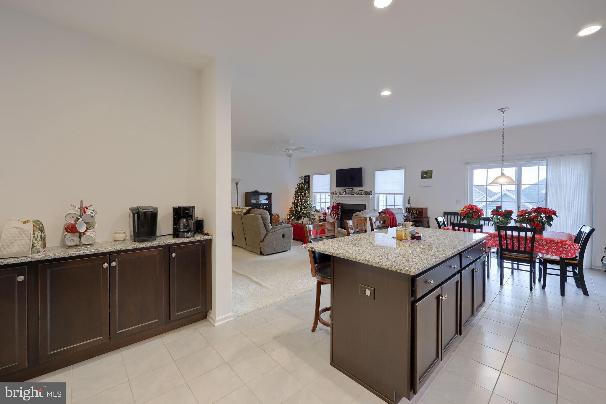 423 Valor Drive Lititz, PA 17543 - Photo 5 of 29 a room with a table chairs and a kitchen