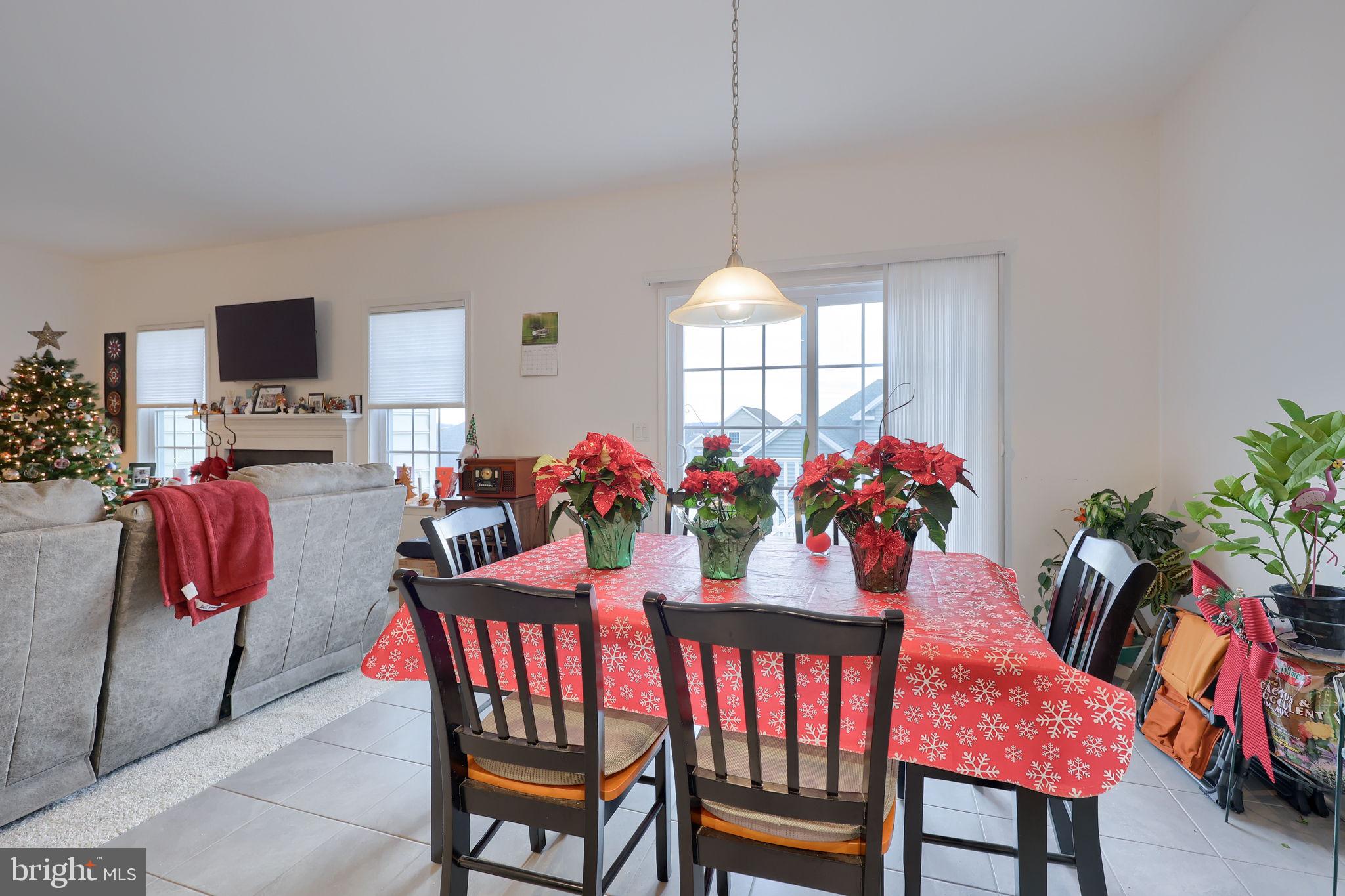 423 Valor Drive Lititz, PA 17543 - Photo 7 of 29 a view of a dining room and livingroom with furniture window and wooden floor