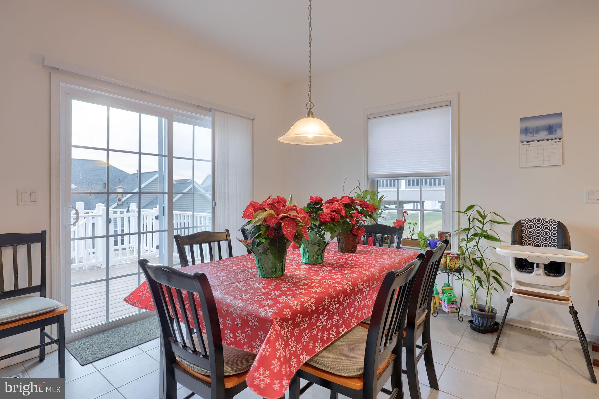 423 Valor Drive Lititz, PA 17543 - Photo 9 of 29 a view of a dining room with furniture and a potted plant