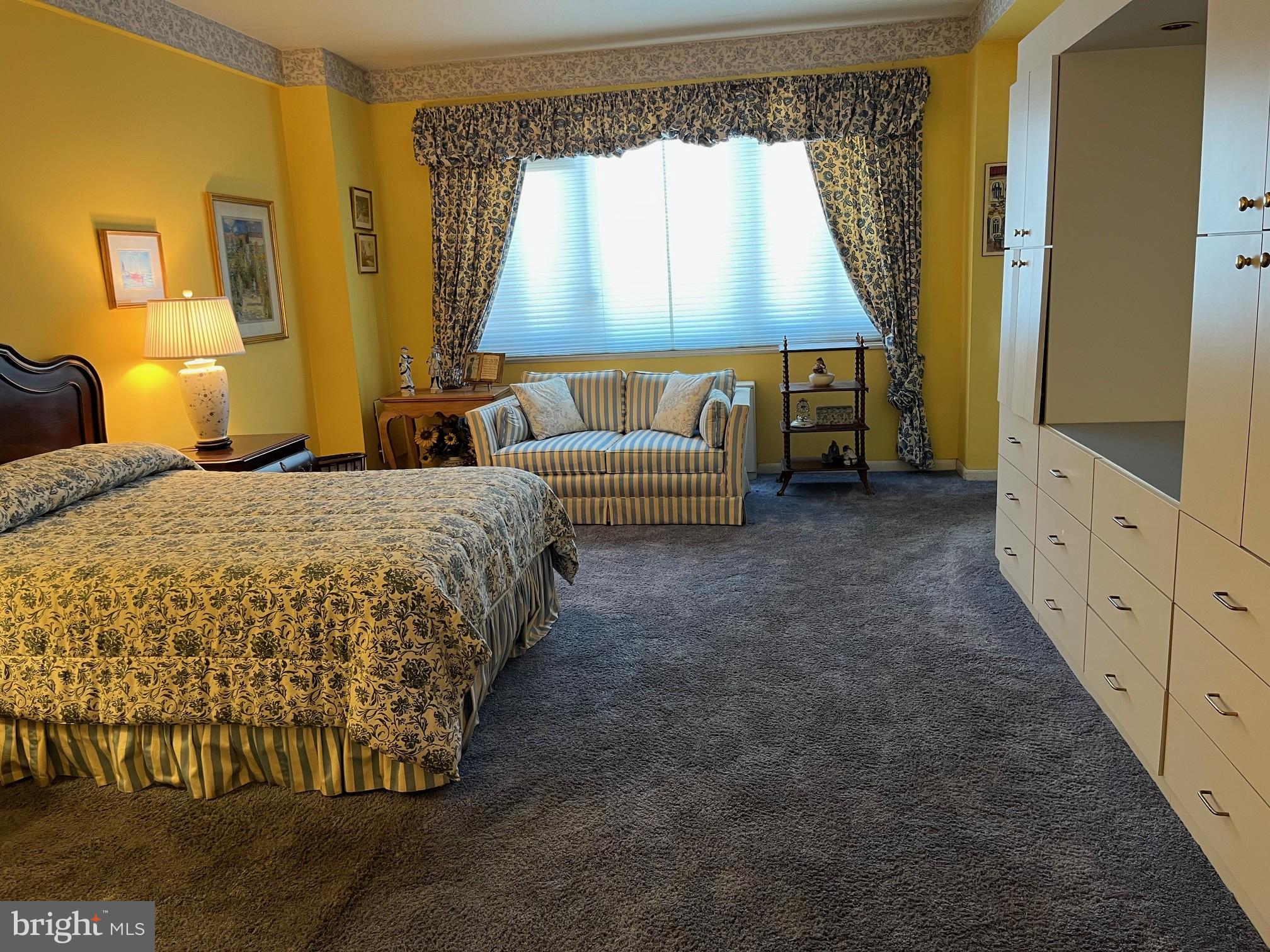 11 Slade Avenue, Unit 603 Baltimore, MD 21208 - Photo 4 of 11 a spacious bedroom with a bed and a window