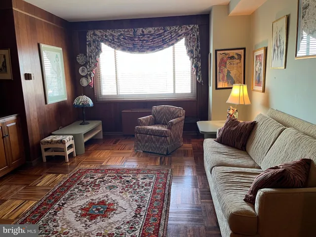 a living room with furniture and a rug