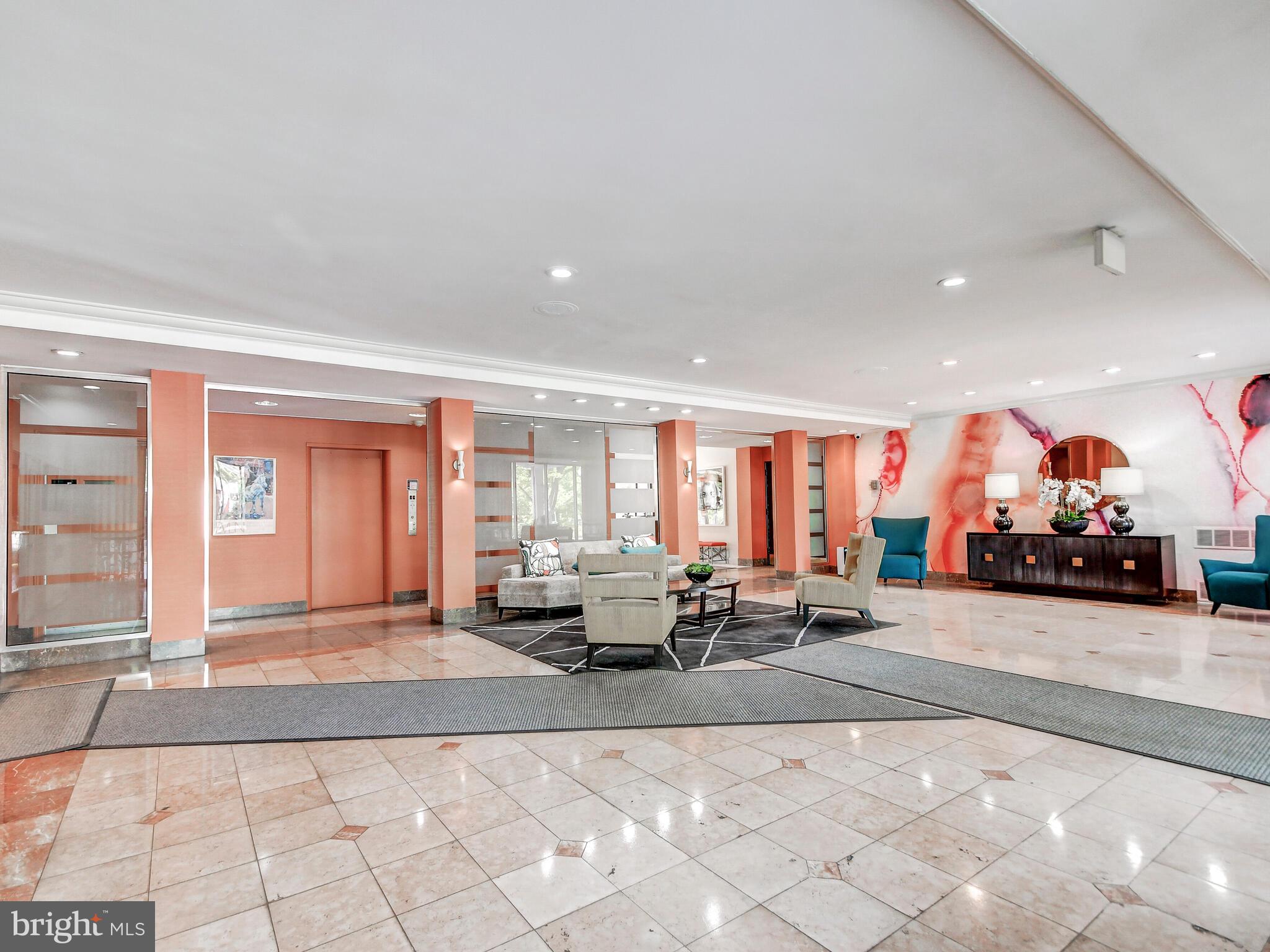 11 Slade Avenue, Unit 603 Baltimore, MD 21208 - Photo 10 of 11 a living room with furniture and large windows